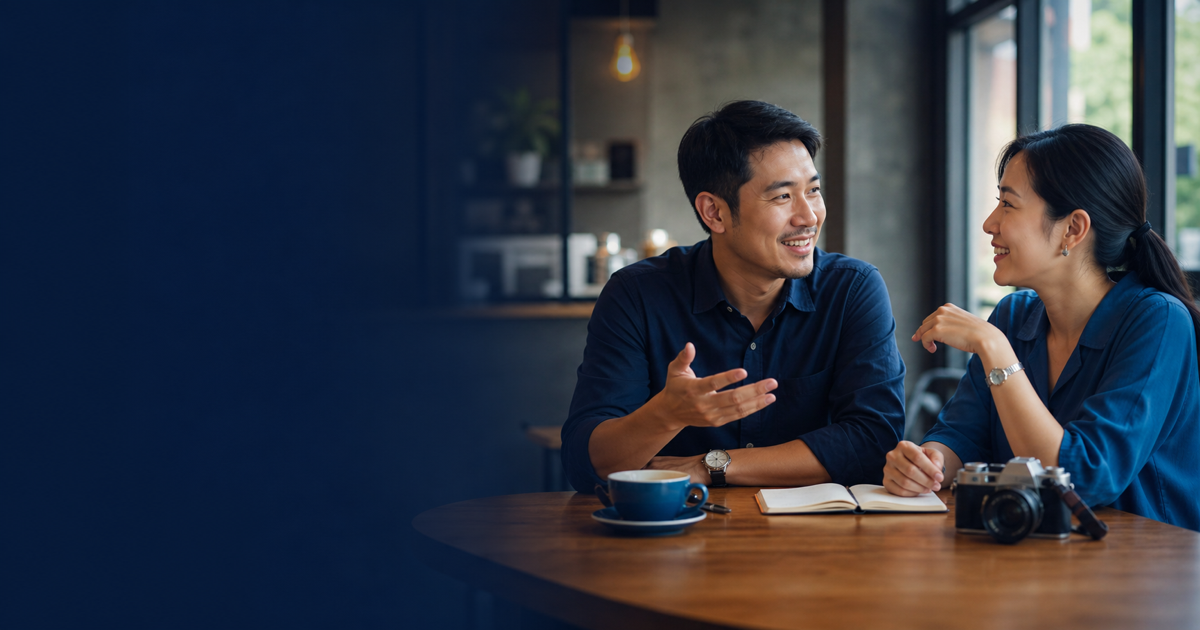 Two adult English learners reconnecting in a café and sharing personal updates