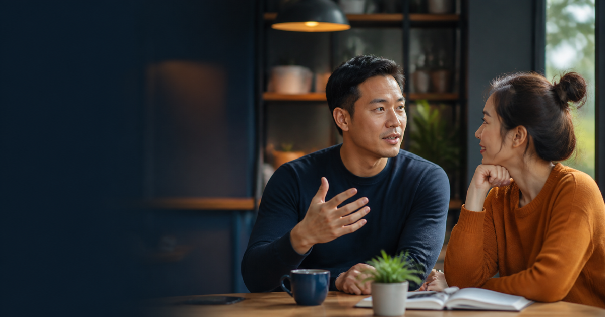 Two adult learners discussing feelings while one listens with empathy
