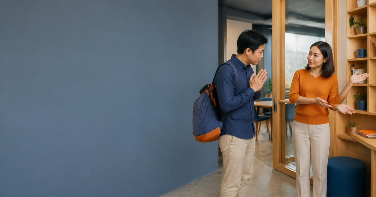 An adult politely asks permission at a shared learning space while another person explains where to go